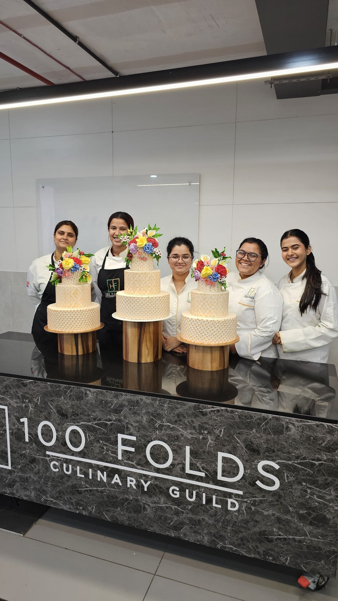 From classroom to celebration — our students mastering the art of wedding cakes.